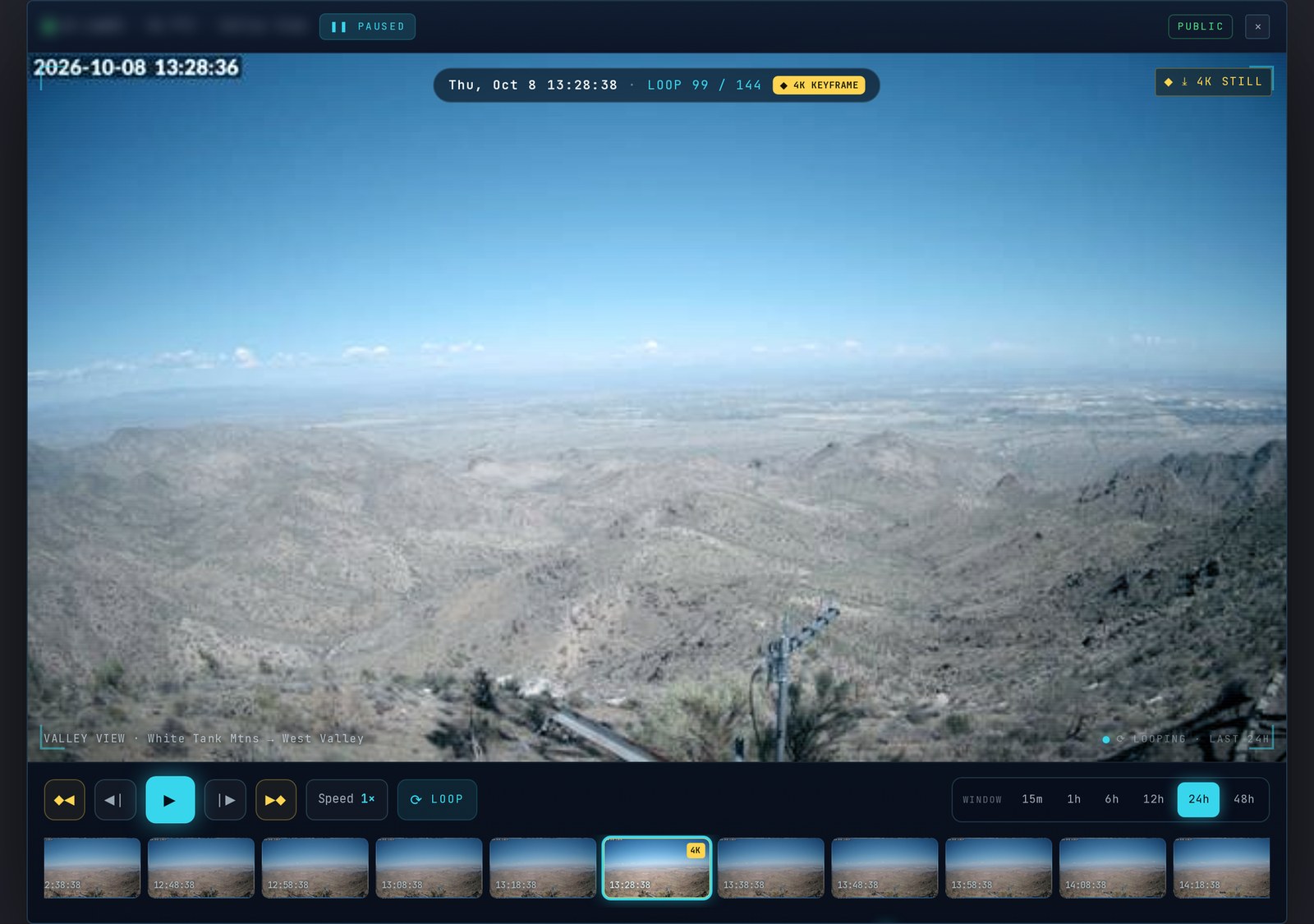 The DVR time-lapse player paused on a daytime frame of the desert foothills and the valley beyond, transport buttons, speed, loop and window choices, and a filmstrip.